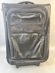 Piel Leather Rolling Suitcase.