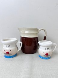 2 Chef Measuring Cups And A Stoneware Pitcher.