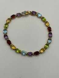 14k Gold Locking Bracelet With Many Colored Stones