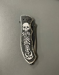 440 Stainless 8 Inch Skull And Bones Folding Knife.