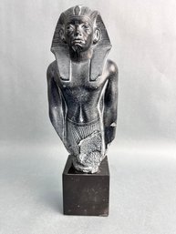 Reproduction Of An Egyptian Pharoah Statue.