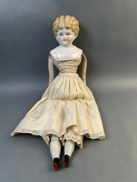 Antique Blond Haired China Head Doll.