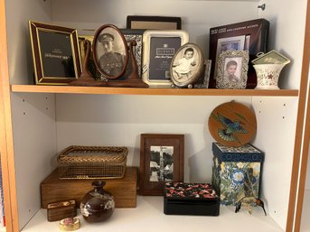 Two Shelves Of Collectibles And Frames