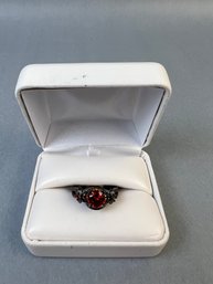 Black Metal And Red Glass Ring Size 8.