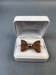 Size 7.5 Gold Tone Bow Ring.