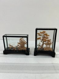 Miniature Japanese Wormwood Crane Carvings In A Glass Case.