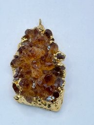 Gold Plated Brownish Amber Crystal With Gold Tone Pendant