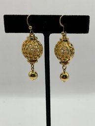 Gold Tone Pierced Earrings With Pearl In The Cage