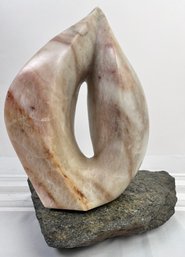 Modernist Stone Sculpture On Rotating Base Signed Harry Shenk, Dated 2002.