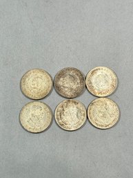 Six Un Peso Coins