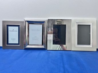 4 Silver Picture Frames.