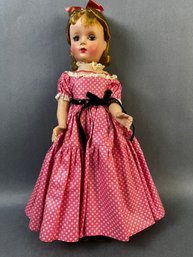 Adorable Doll In A Pink Dress.