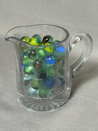 Lot Of Marbles In EAPG Etched Creamer