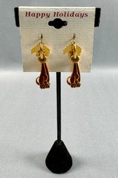 Gold Tone Pierced Earrings With A Dog  Motif