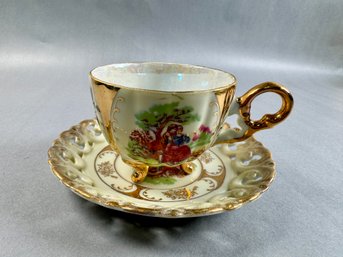 Cup And Saucer With Picture Of Lovers And Gold Feet