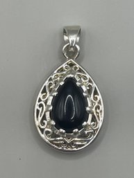 Silver Tone Filigree Pendant With Black Stone