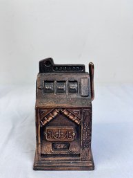 Vintage Copper Tone One Armed Bandit Coin Bank.
