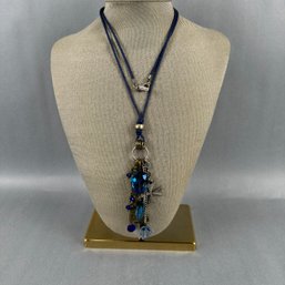 Blue Cord With A Multiple Dangle Pendant By Mythologie