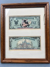 2 Framed 1987 Disney Dollars.