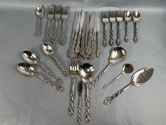 12 Place Settings Of Oneida Community Stainless Flatware With Serving Utensils.