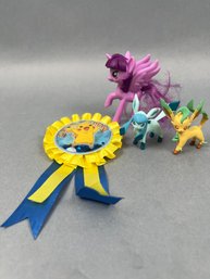 3 Pokemon Toys And A Purple Winged Horse.