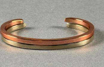 2 Cuff Bracelets- Gold Tone And Silver Tone