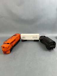Lionel Diesel Switcher, Savings Bank And Lionel Lines Trains.