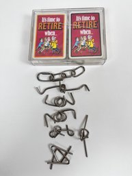 2 Decks Of Funny Retirement Cards And Some Steel Wire Puzzles To Enjoy In Your Retirement.