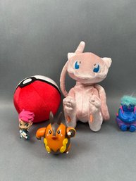 3 Pokeman Toys And 2 Other Dolls.