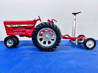 True Scale Toy Tractor With Sickle Bar Attachment.
