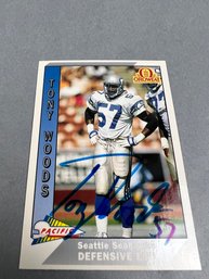 Autographed 1991 Pacific Tony Woods Seattle Seahawk Football Card.
