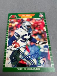 Autographed 1989 Pro Set Tony Woods Seattle Seahawk Football Card.