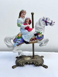 Nurse Holding A Child On A Carousel Horse.