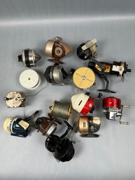 Lot Of 13 Fishing Reels And Some Rolls Of Line.