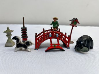 Miniature Figures. Asian Is Iron, Bear Carved Stone, Skunk Is Porcelain.