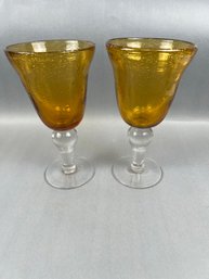 Pair Of Amber Bubble Glass Goblets With Clear Stems.