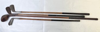 4 Vintage Wood Handled Leather Wrapped Golf Clubs.