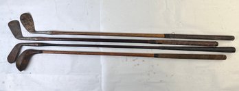4 Antique Wood Shaft Leather Wrapped Golf Clubs.