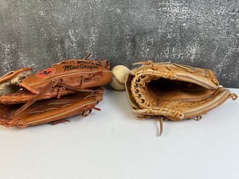 2 Leather Baseball Gloves.