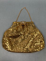 Gold Mesh Bag With Gold Chain And Jeweled Closure.
