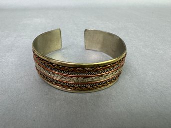 Cuff Bracelet With Twisted Metal Design