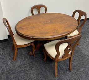 Oval Wood Pedestal Dining Table With Center Inlay Design And 4 Chairs