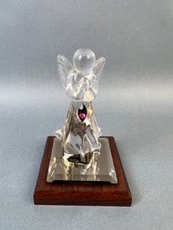Dacra Glass Company Angel On Wood Base With Purple Stone.