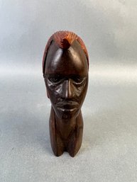 Wood Carving Of An Indigenous Person.