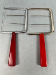 2 Vintage Red Bakelite Handled Cheese Cutters.