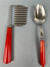 2 Vintage Red Bakelite Handled Utensils.