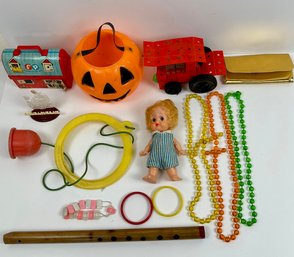 Assortment Of Childrens Toys Including A Footsie Jumper Snd Fisher Price Barn Lunchbox.