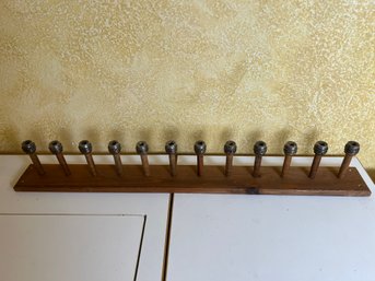 Coat Rack Made With Weaving Shuttles.