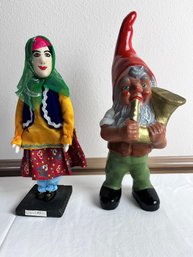 Garden Gnome And Middle Eastern Doll.