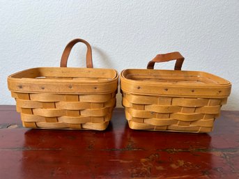 2 Longaberger Baskets With Leather Handles.